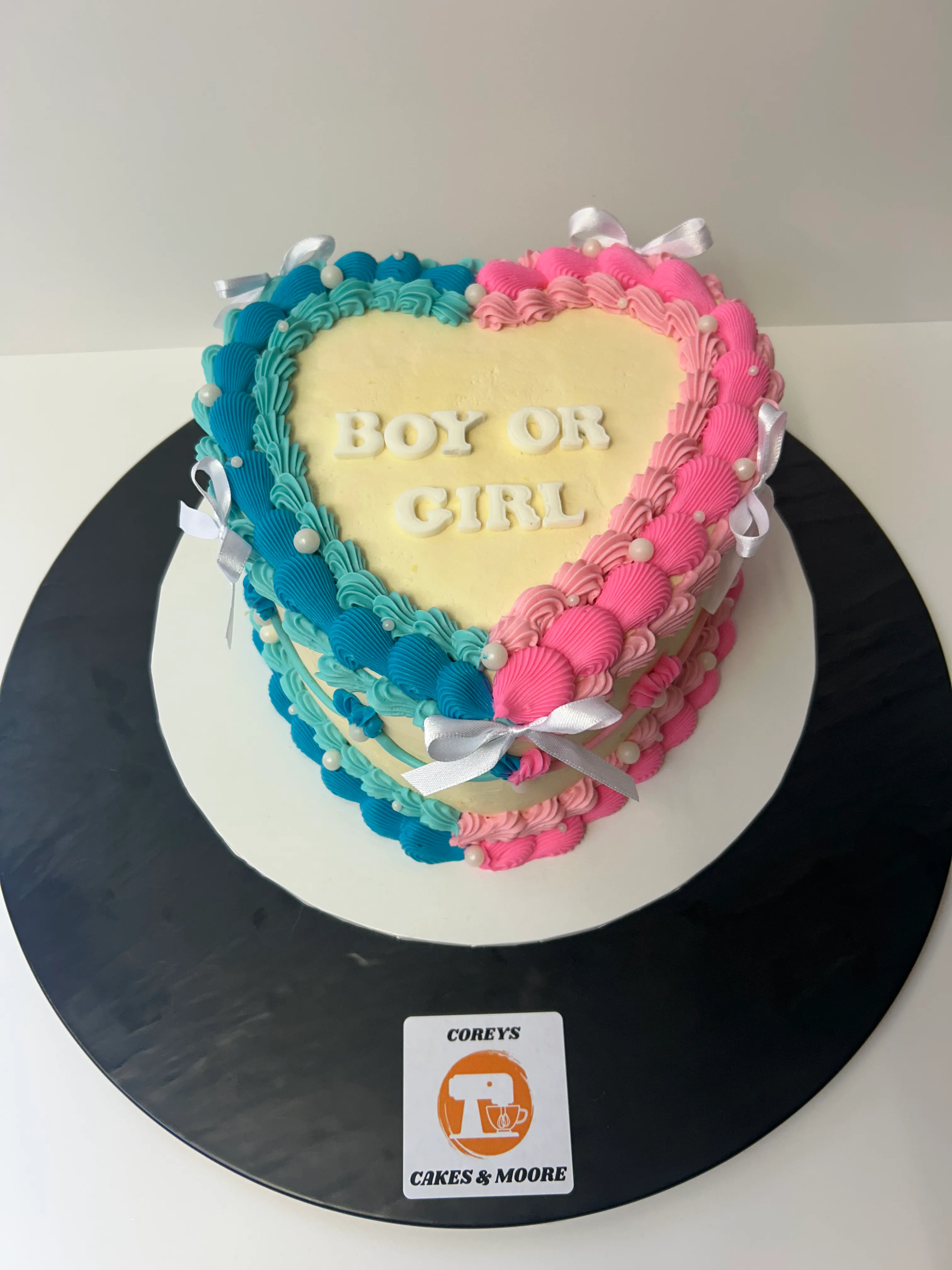A blue and pink gender reveal birthday cake